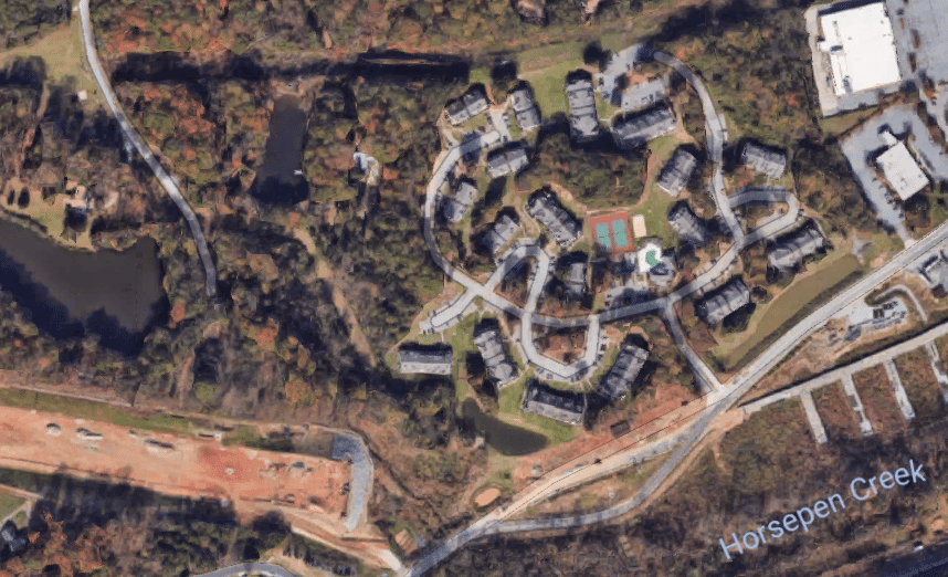 Aerial view of the Landmark at Battleground Park apartment complex. Note the highway construction present in the lower left hand corner of the image.